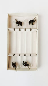 Two sets of glass drink stirs